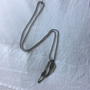 Long silver necklace with wings